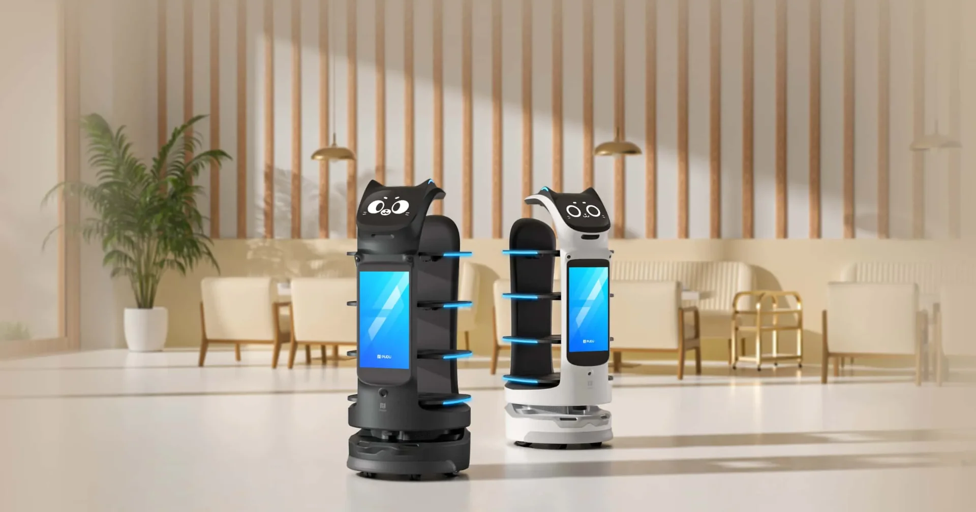 Two commercial delivery robots in a hotel lobby