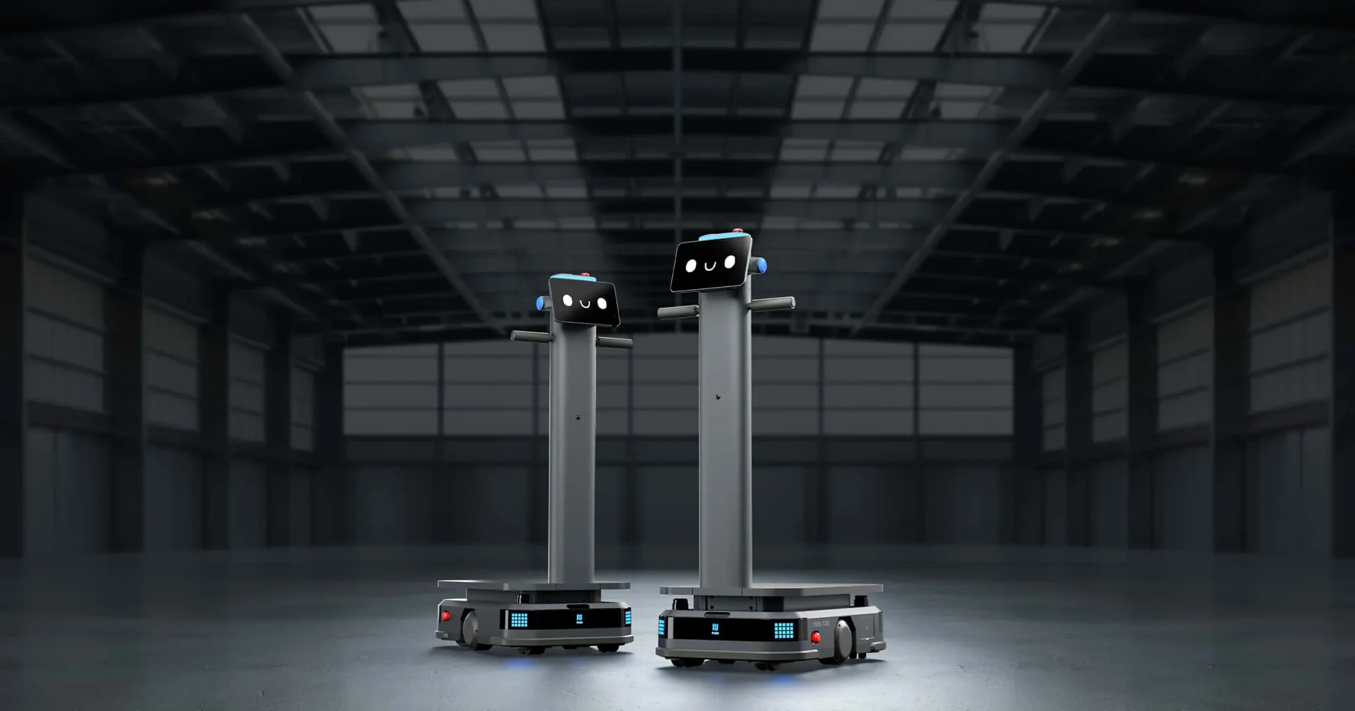Two industrial delivery robots in a warehouse setting